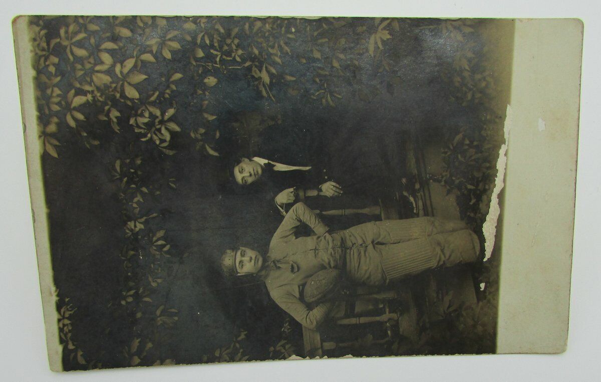 Vintage Postcard with a picture of 2 football players in old uniforms 140082